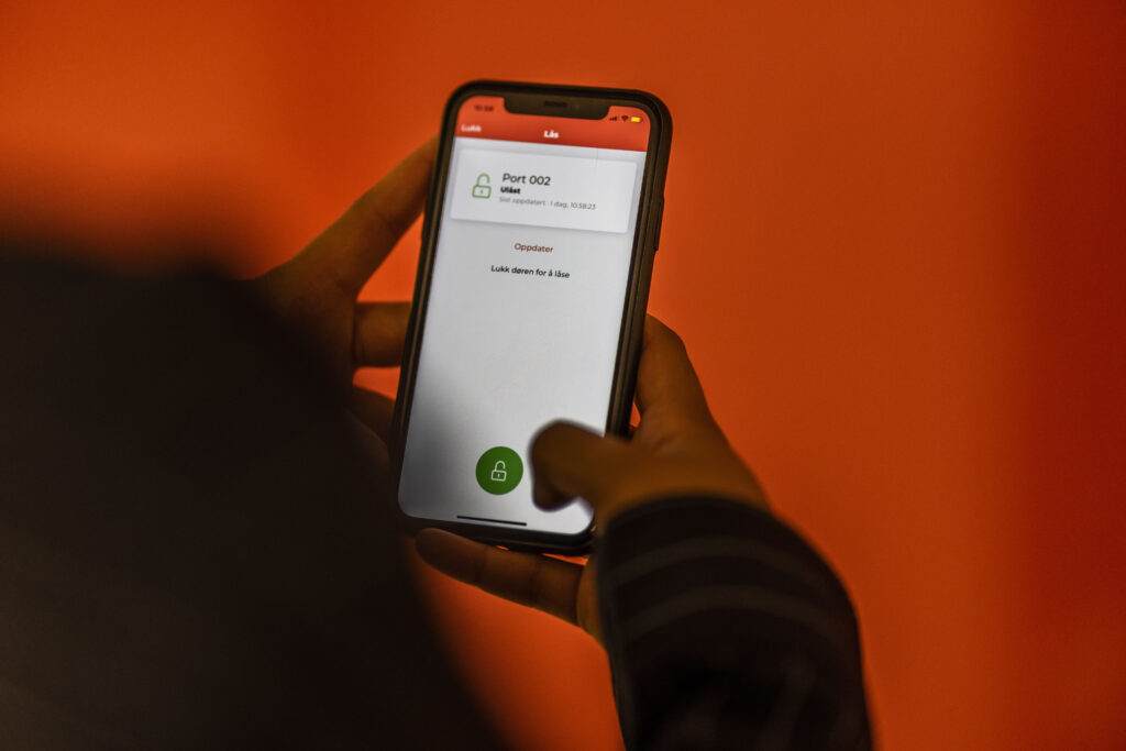 Someone unlocking a flexistore unit with a digital key